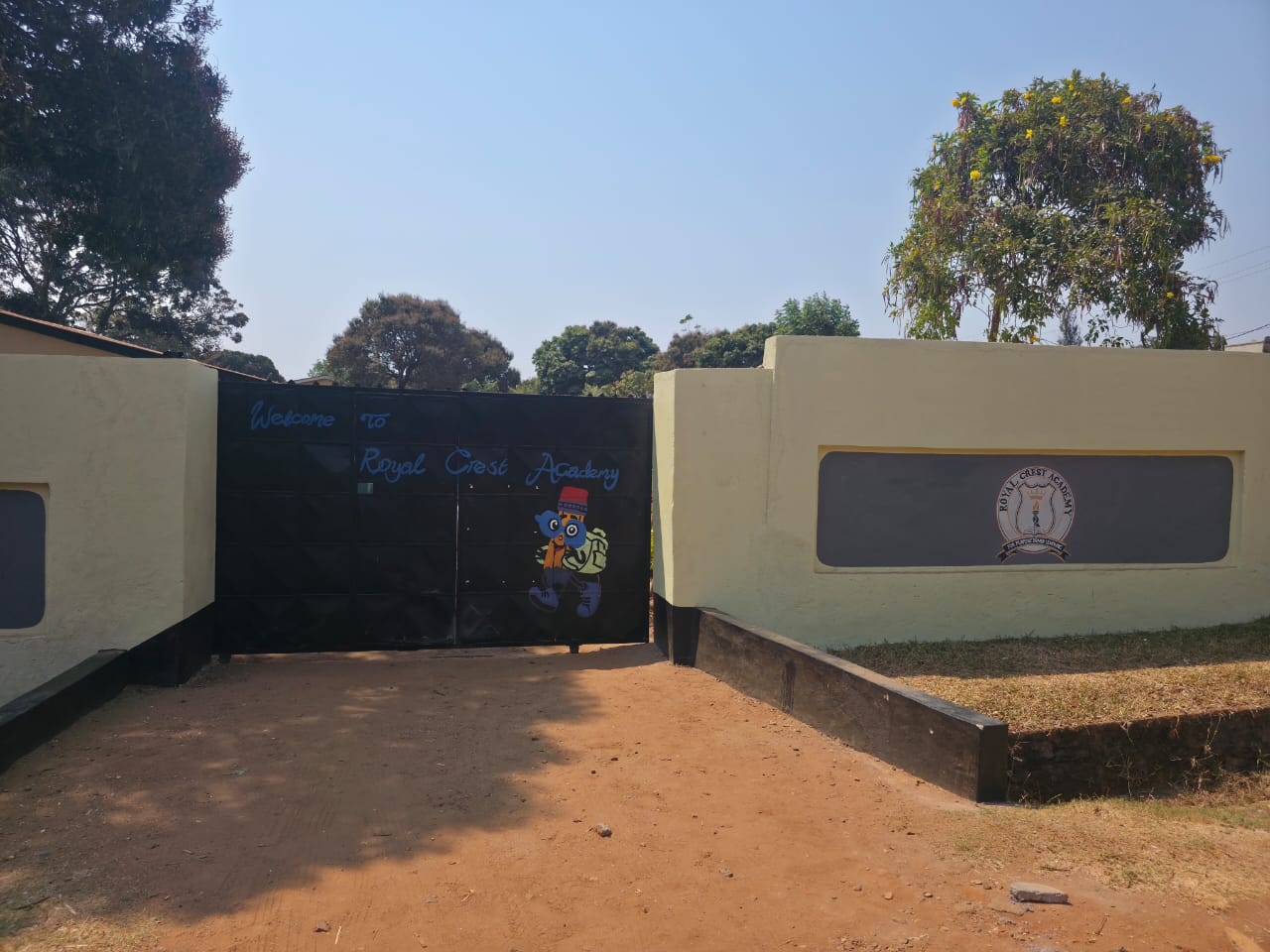 Welcome gate at Royal Crest Academy campus