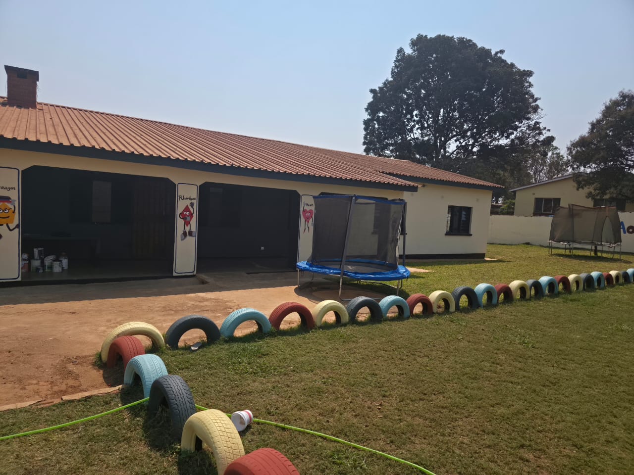 Classroom block and colourful tyre garden borders
