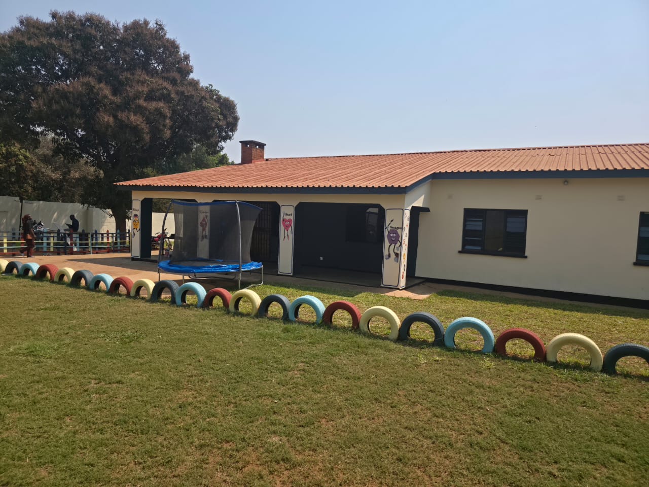 Nursery block with play area and trampoline